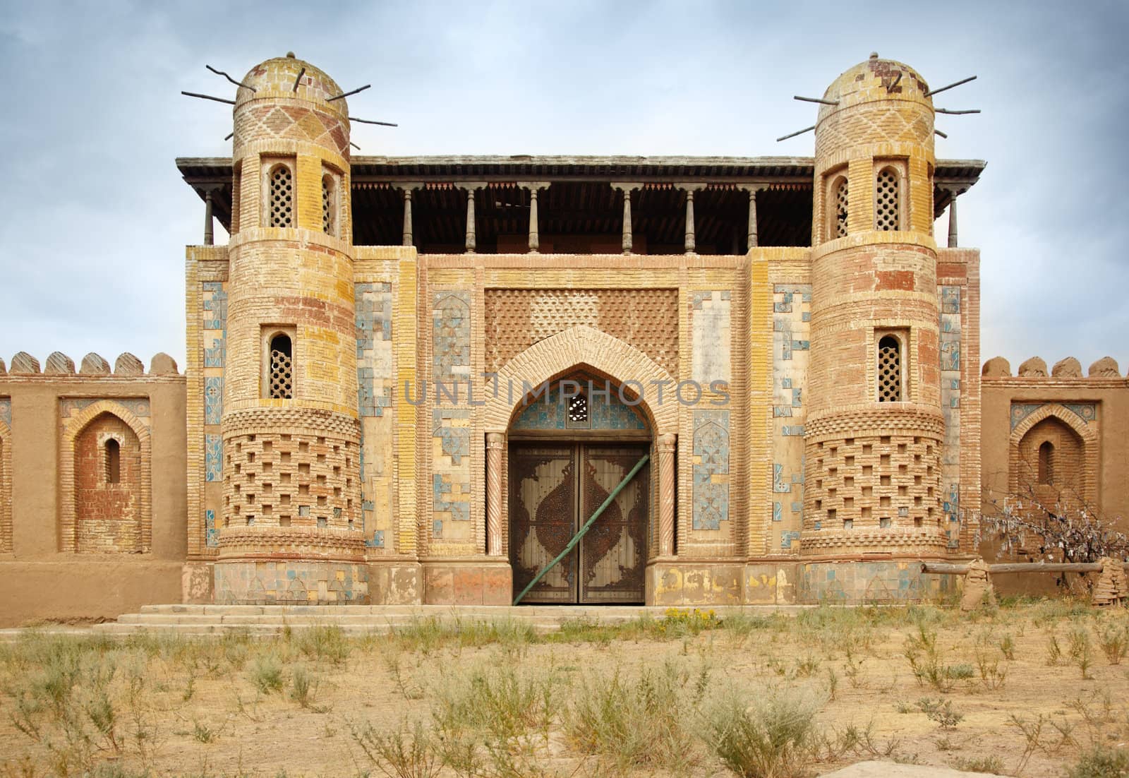 Ancient nomadic city in the steppe. Front view onto the old gates. Natural colors and light