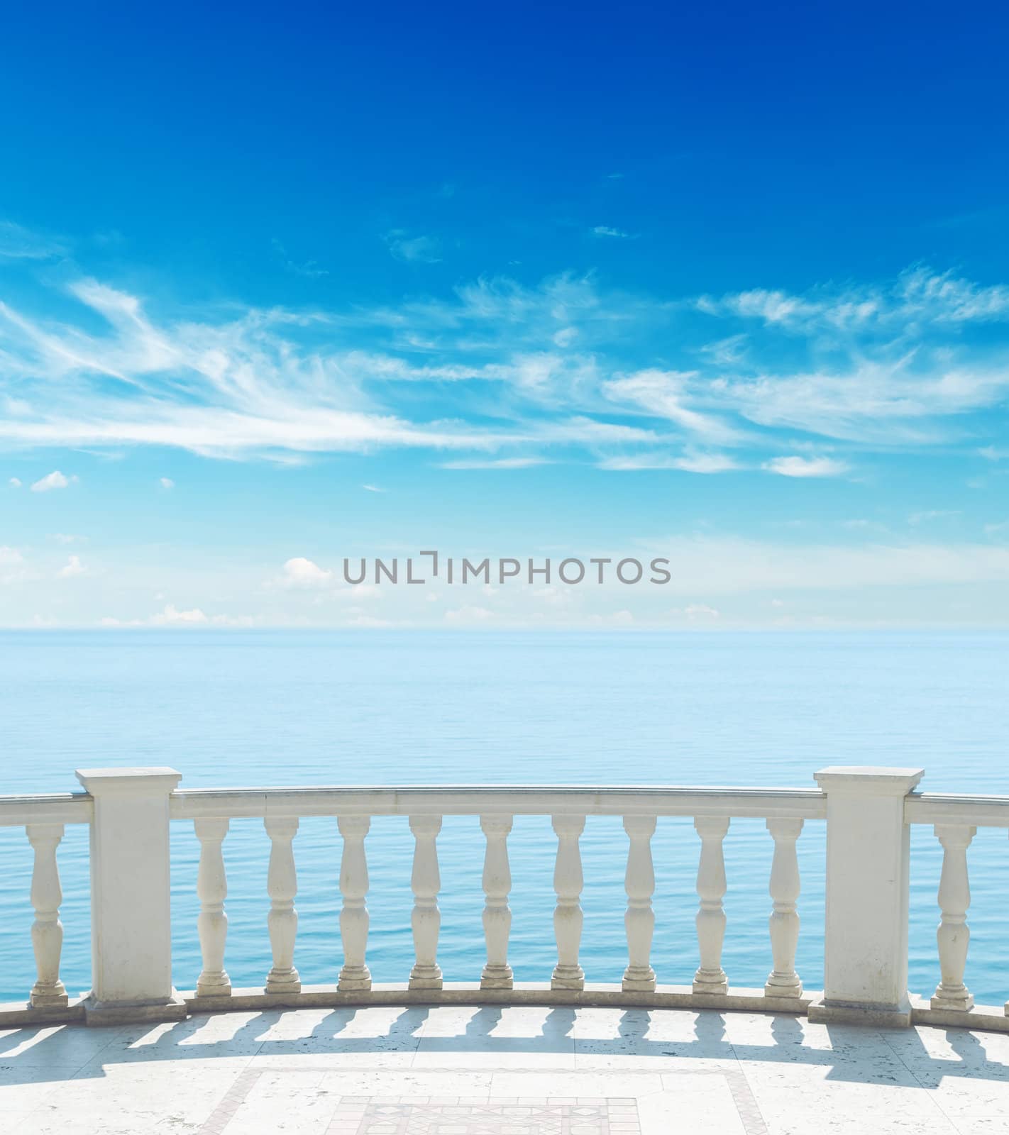 balcony near sea under cloudy sky by mycola