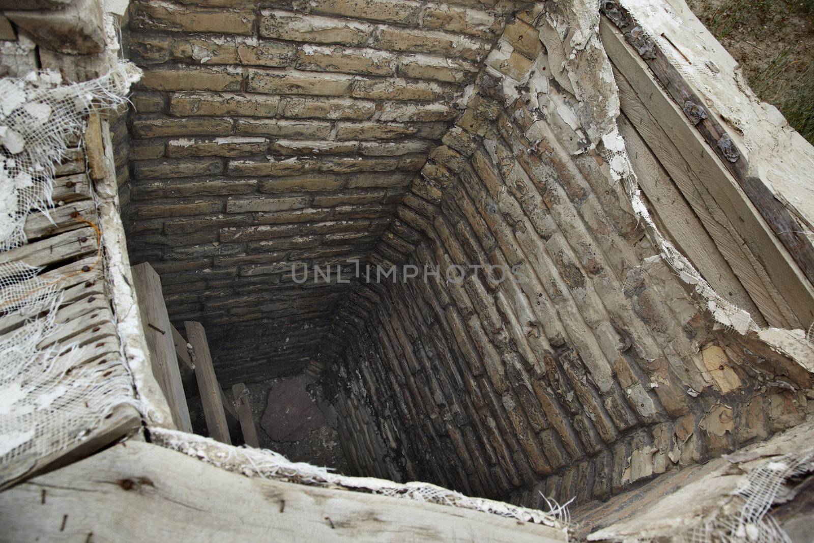 Ancient dried water well at archeological site. Horizontal photo