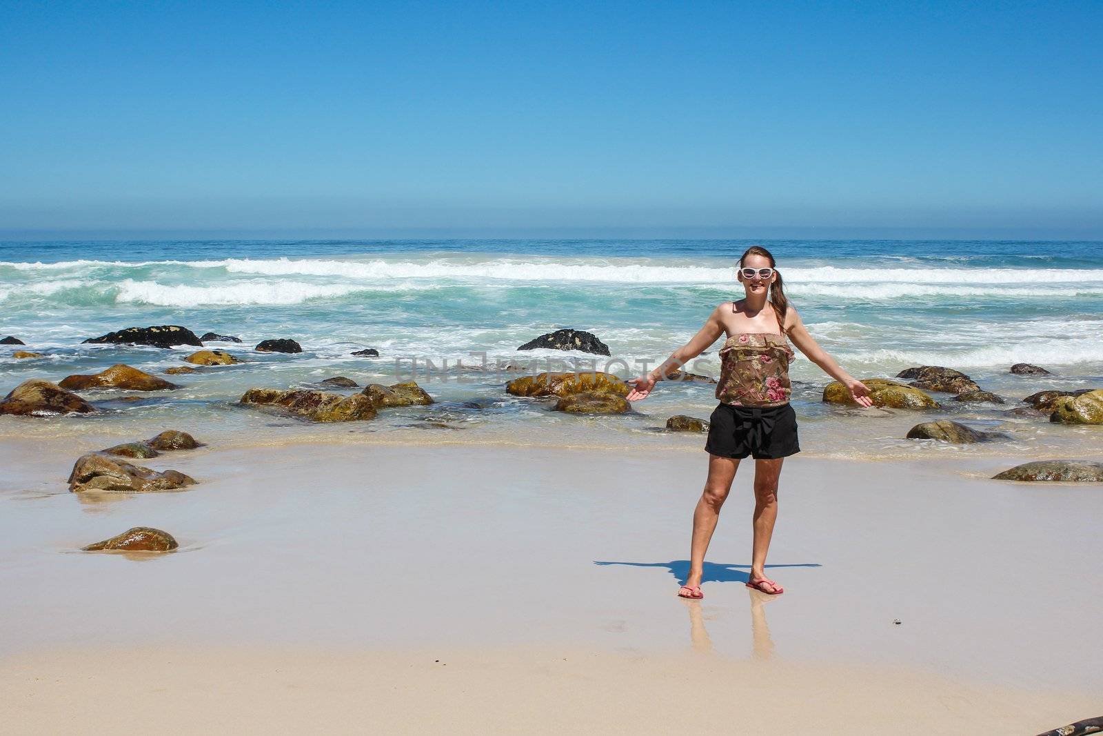 Woman standing at a beach in cape town south africa