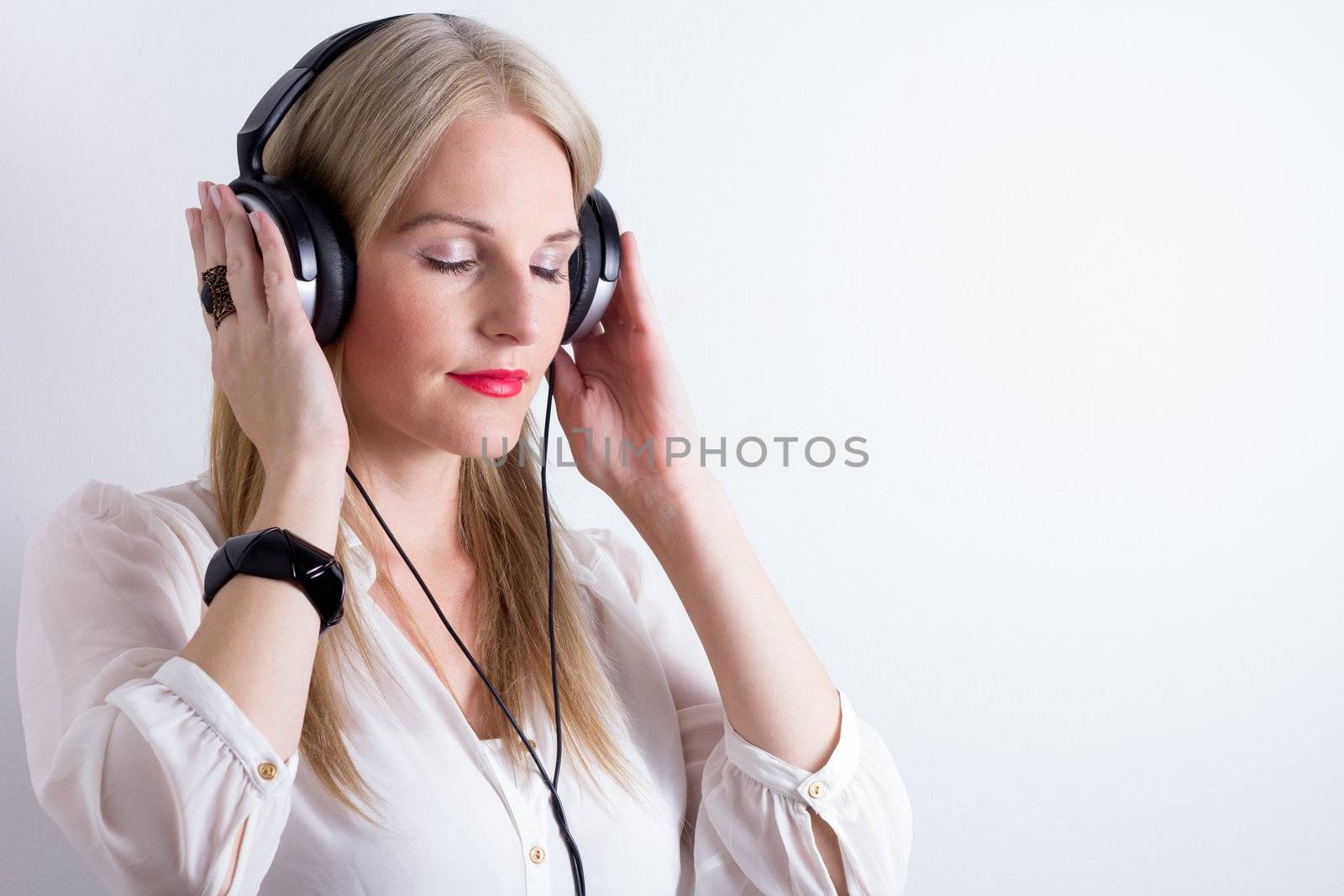 Image of Woman Listening To Music by dwaschnig_photo