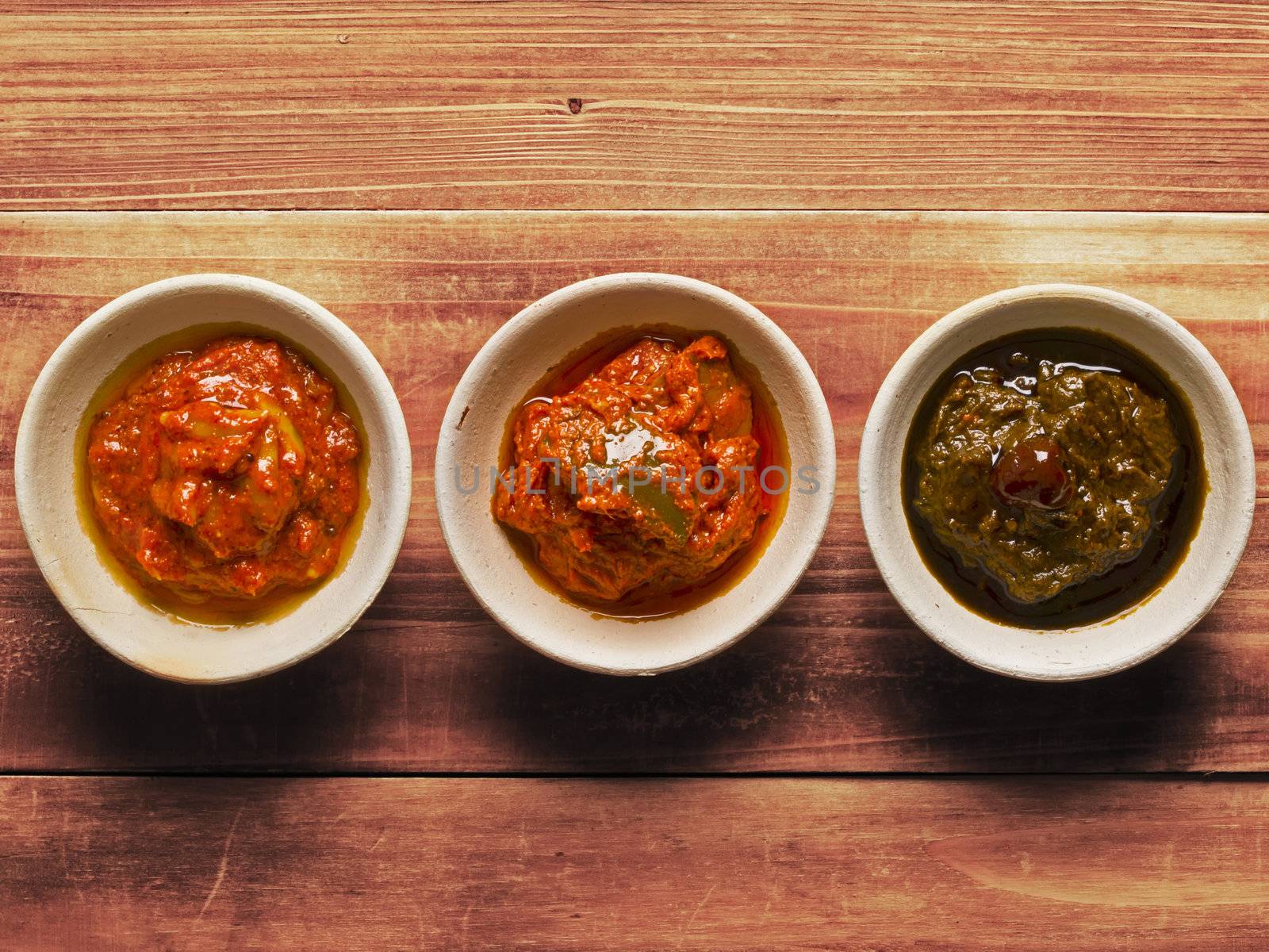 close up of bowls of indian pickles