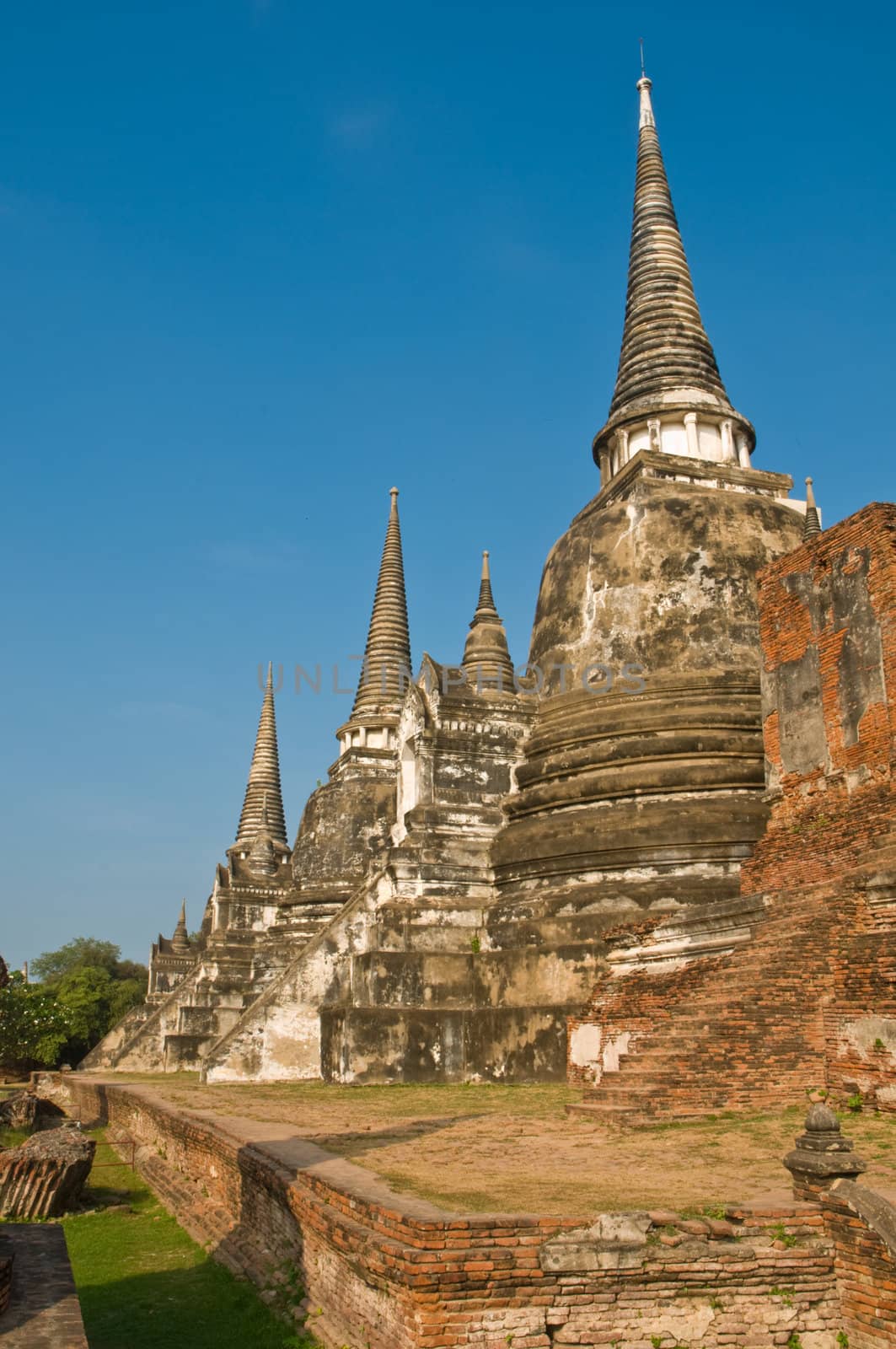 Stupas (chedis) of a Wat in Ayutthaya, Thailand. Ayutthaya city is the capital of Ayutthaya province in Thailand. Its historical park is a UNESCO world heritage.