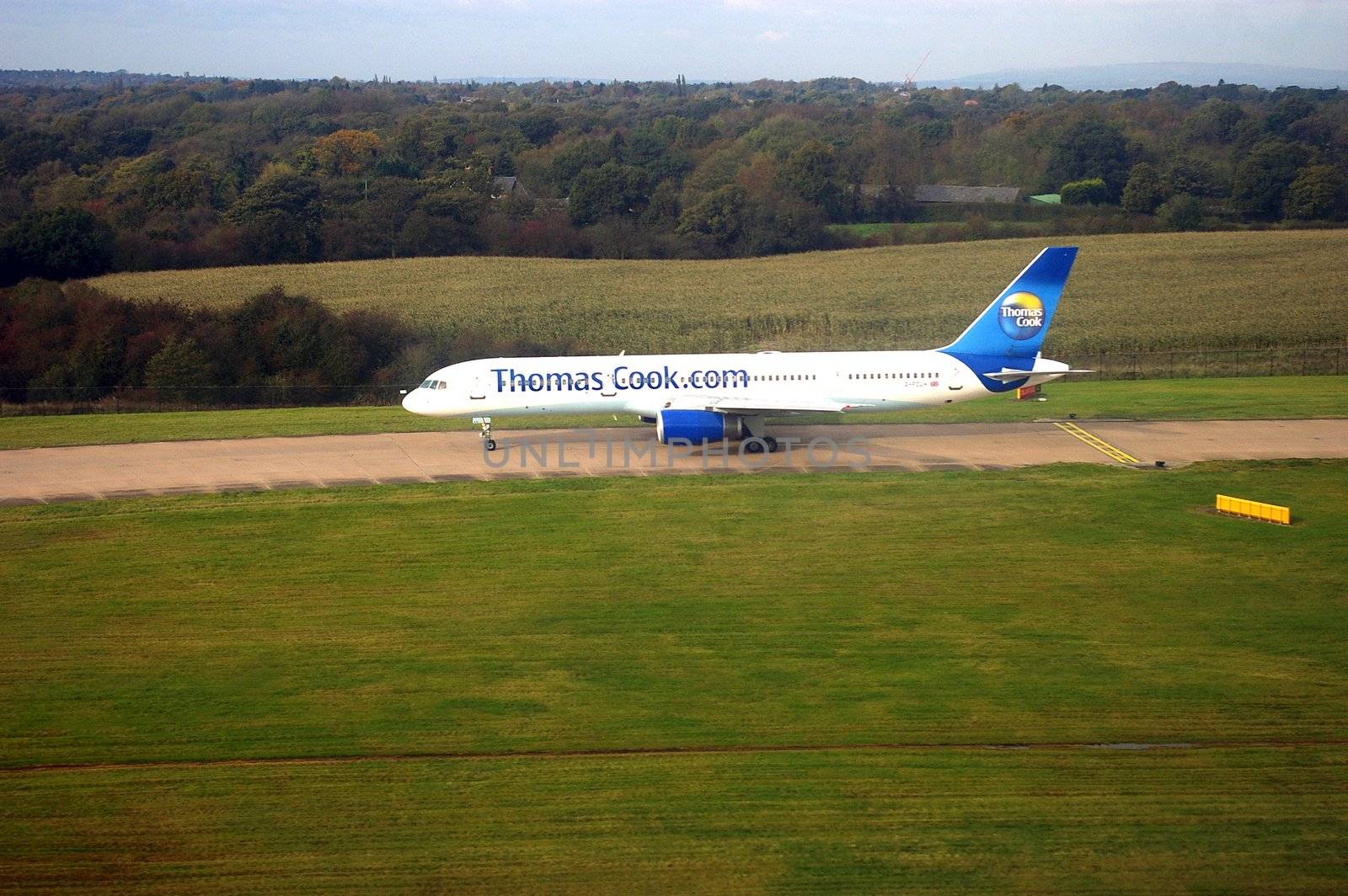 Thomas Cook flight at Manchester airport. This British tour operator carried 7,969,693 passengers during 2011, and employs 19,000 people in the travel industry. Manchester, UK.