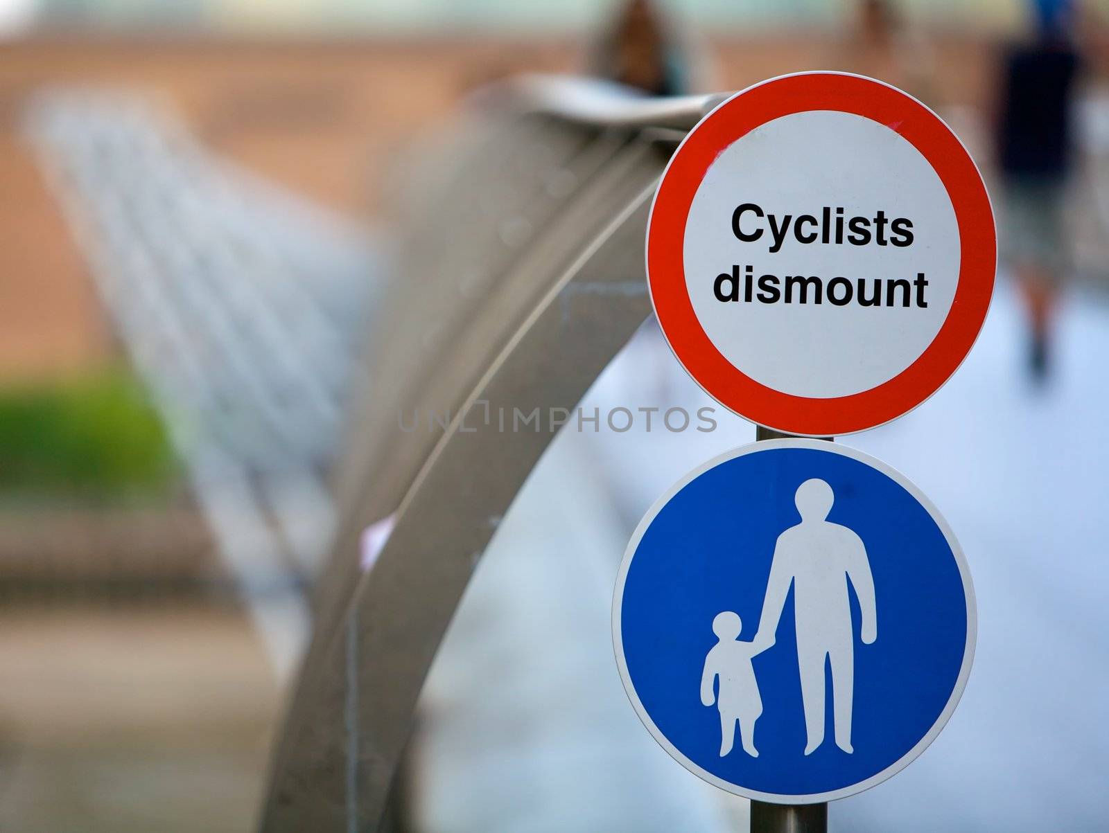 Cyclists track sign for bicycles on a bridge