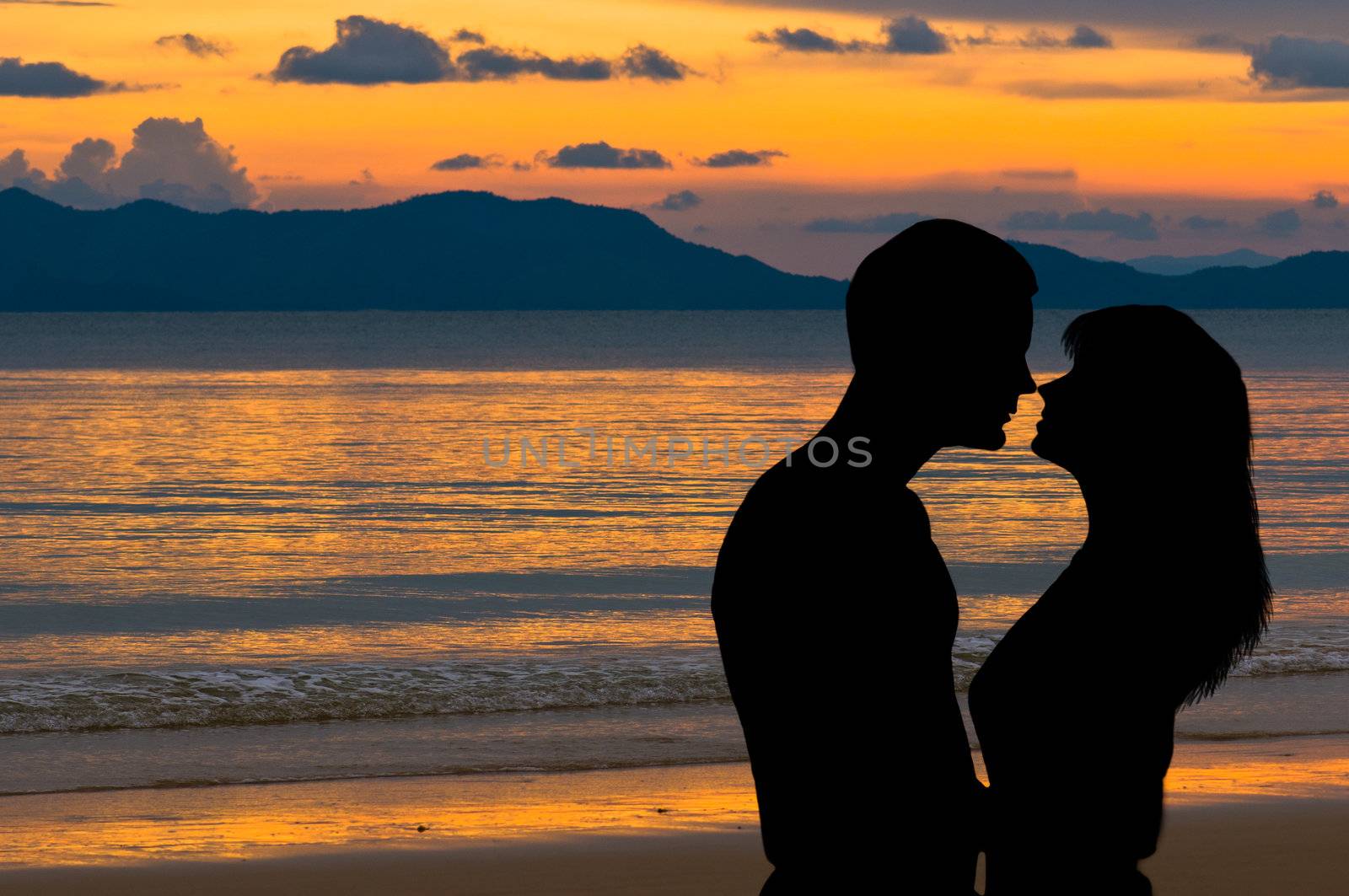 Couple in love at sunset on the beach