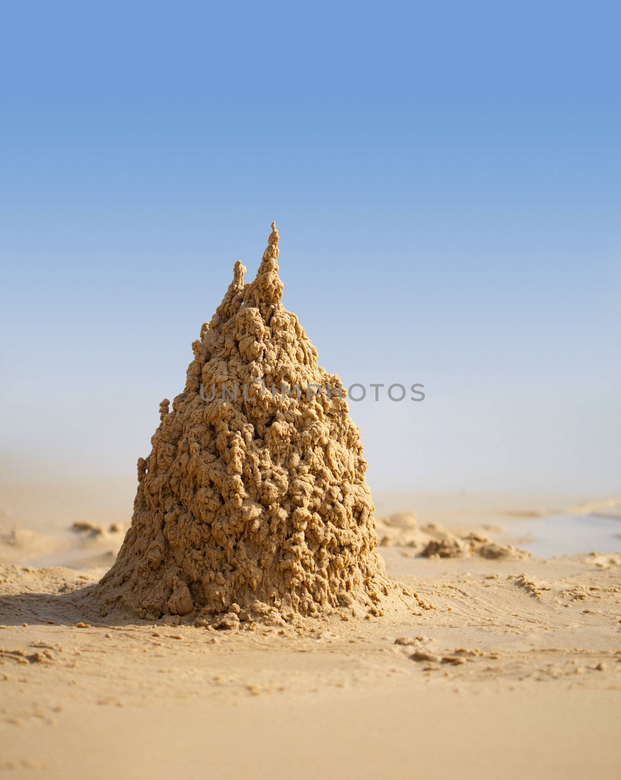 Surreal sand castle on a sunny tropical beach