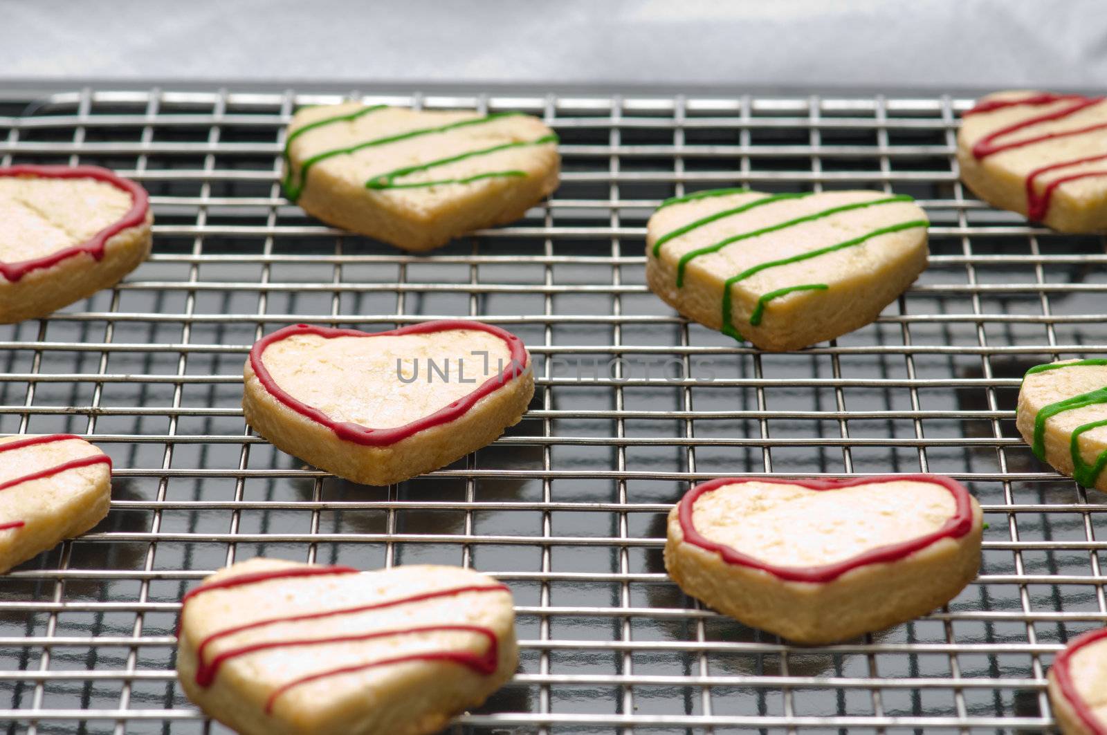 Decorated heart shape christmas cookies on the backing tray