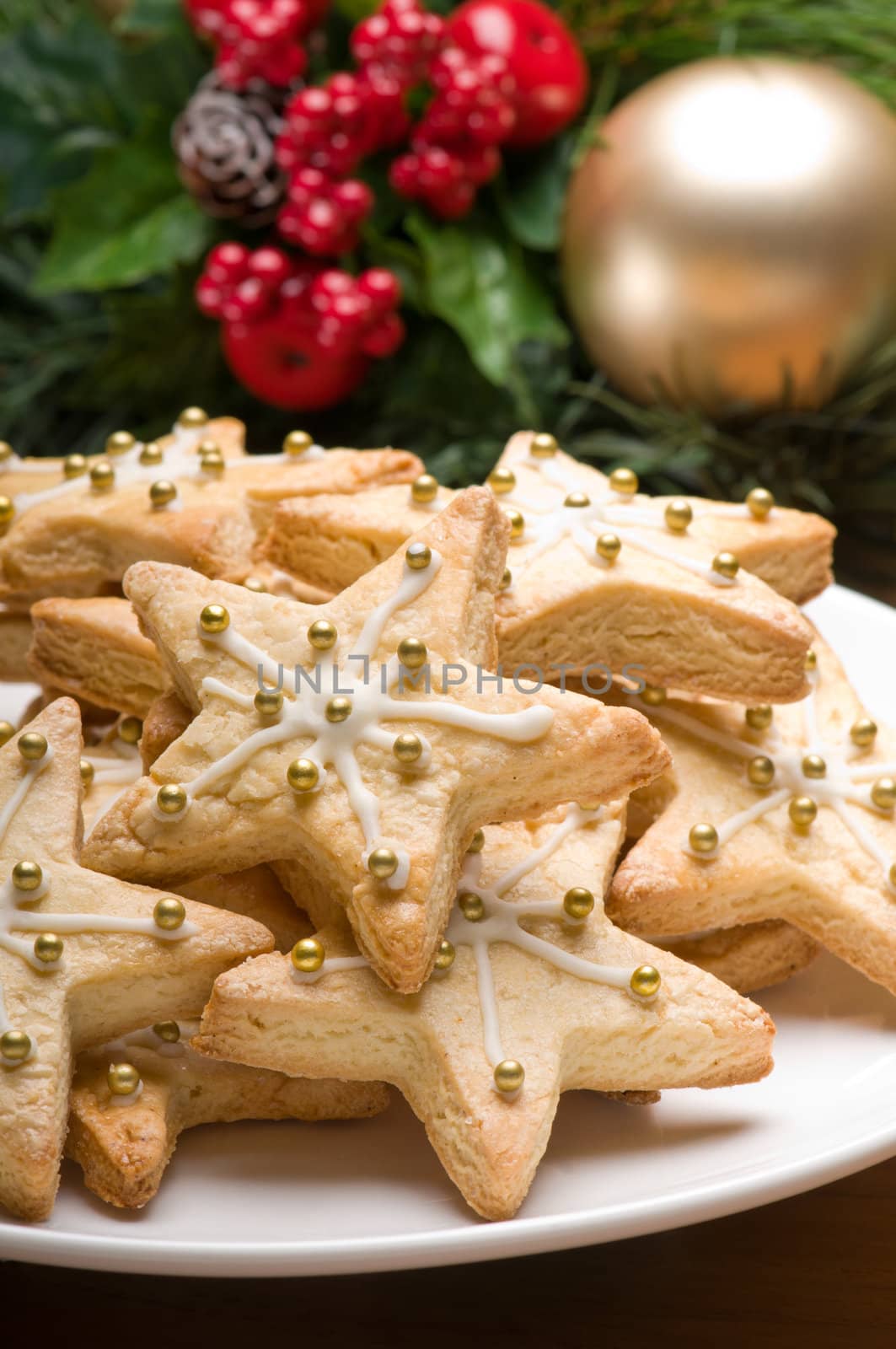 Decorated cookies in festive setting with green decoration