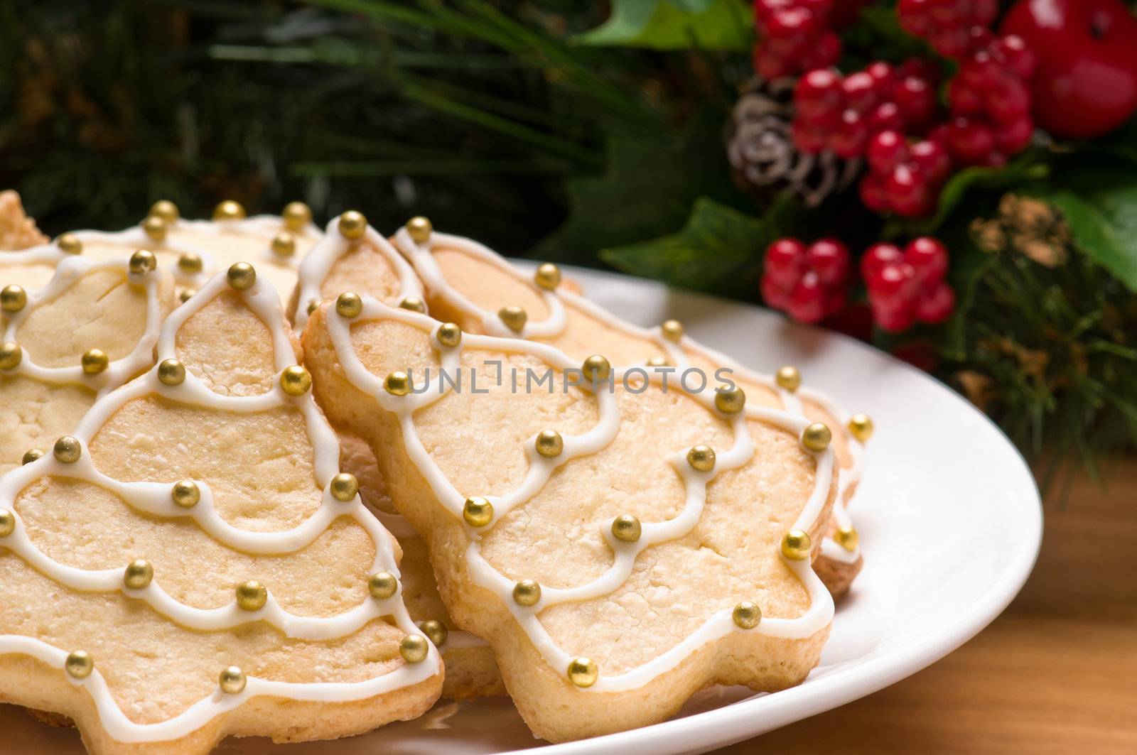 Decorated christmas cookies in festive setting with tree decoration