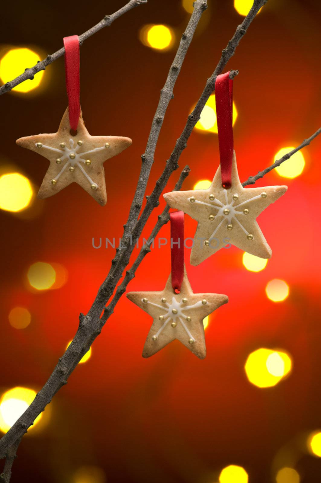 Christmas cookies as tree decoration with a red gold back fround