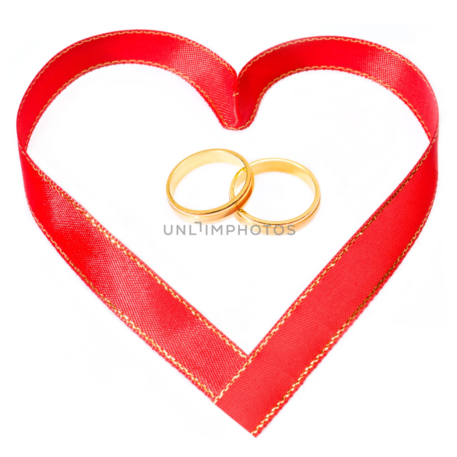 Two golden rings in side a red gold heart shape ribbon