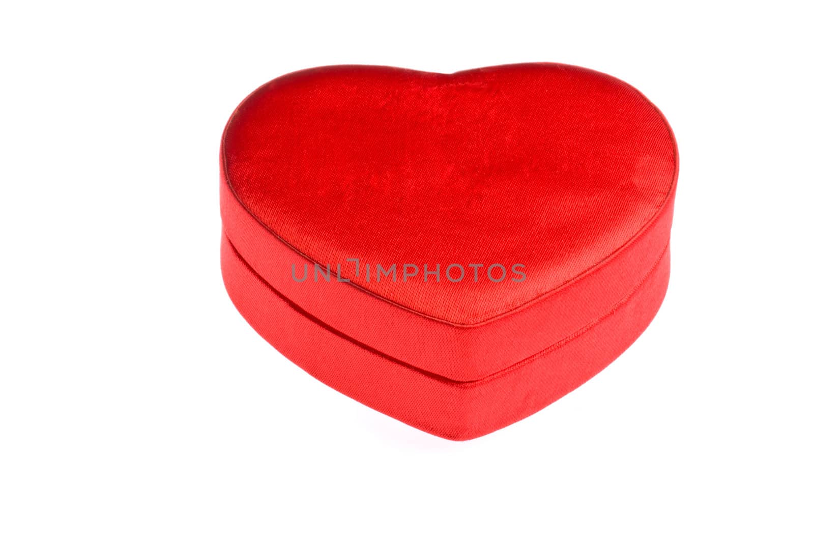 Closed red heart shape box over white