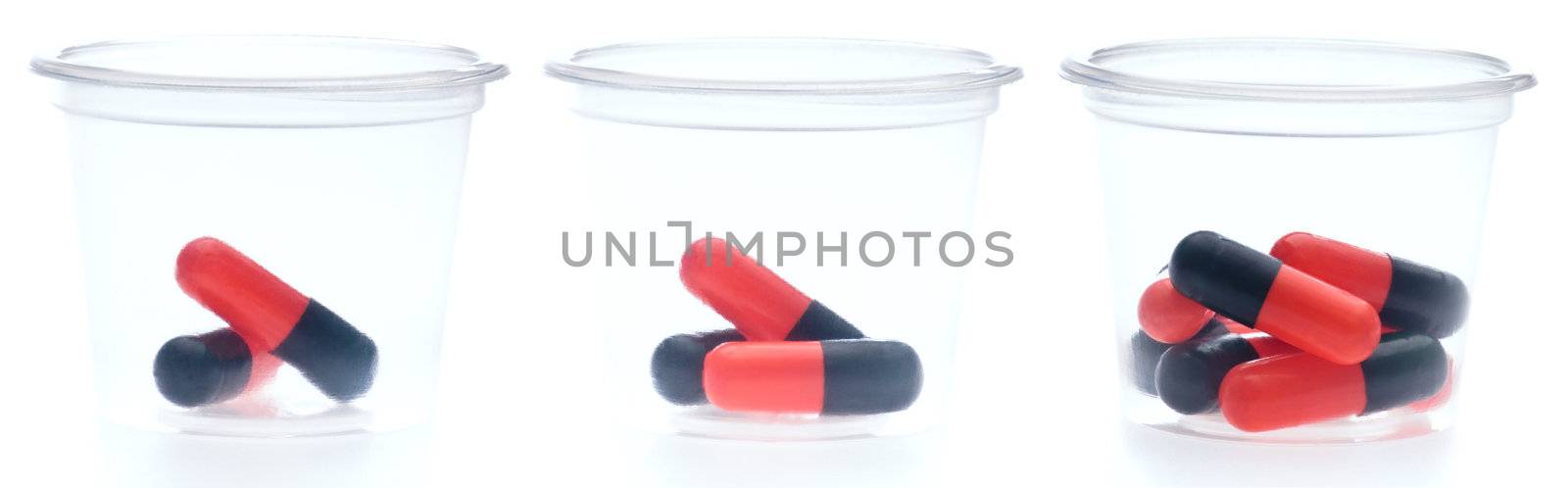 Three containers with different amount of pills by 3523Studio