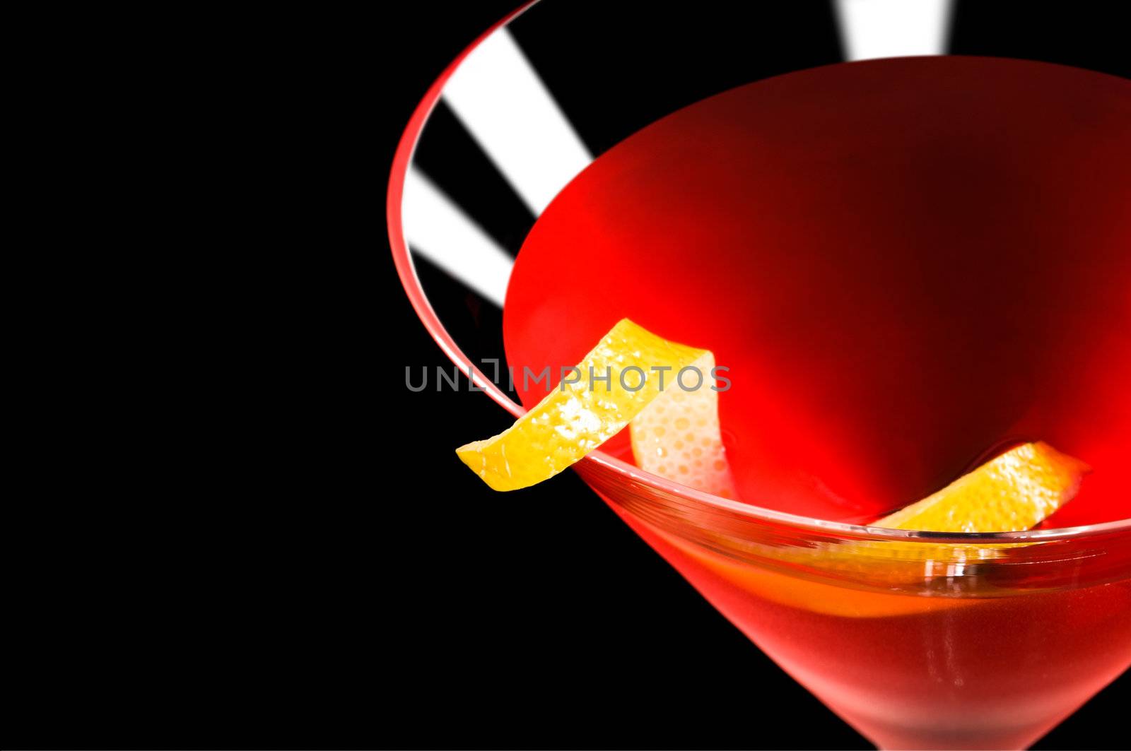 Cosmopolitan cocktail in front of a black background by 3523Studio