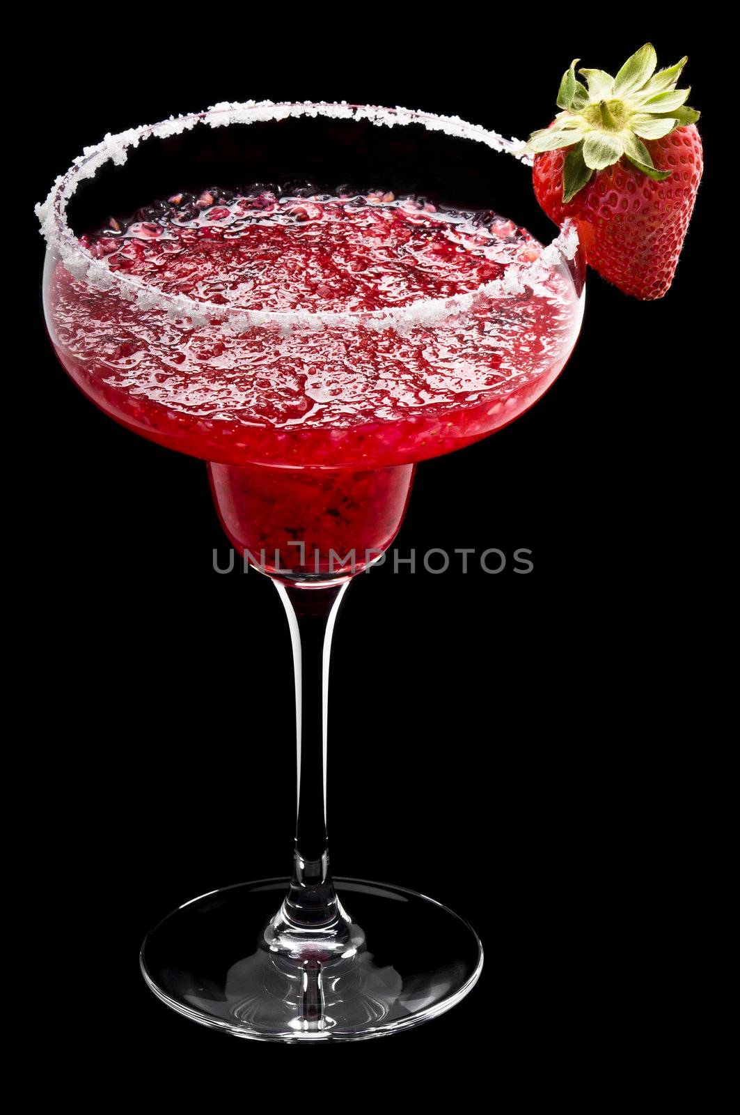 Strawberry Margarita in front of a black background with fresh garnish