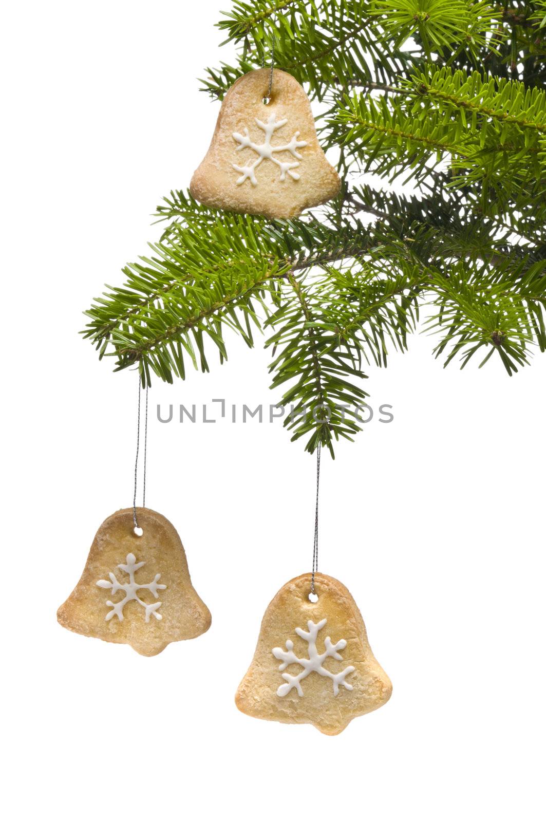 Tree bell shape cookies as Christmas tree decoration, over white