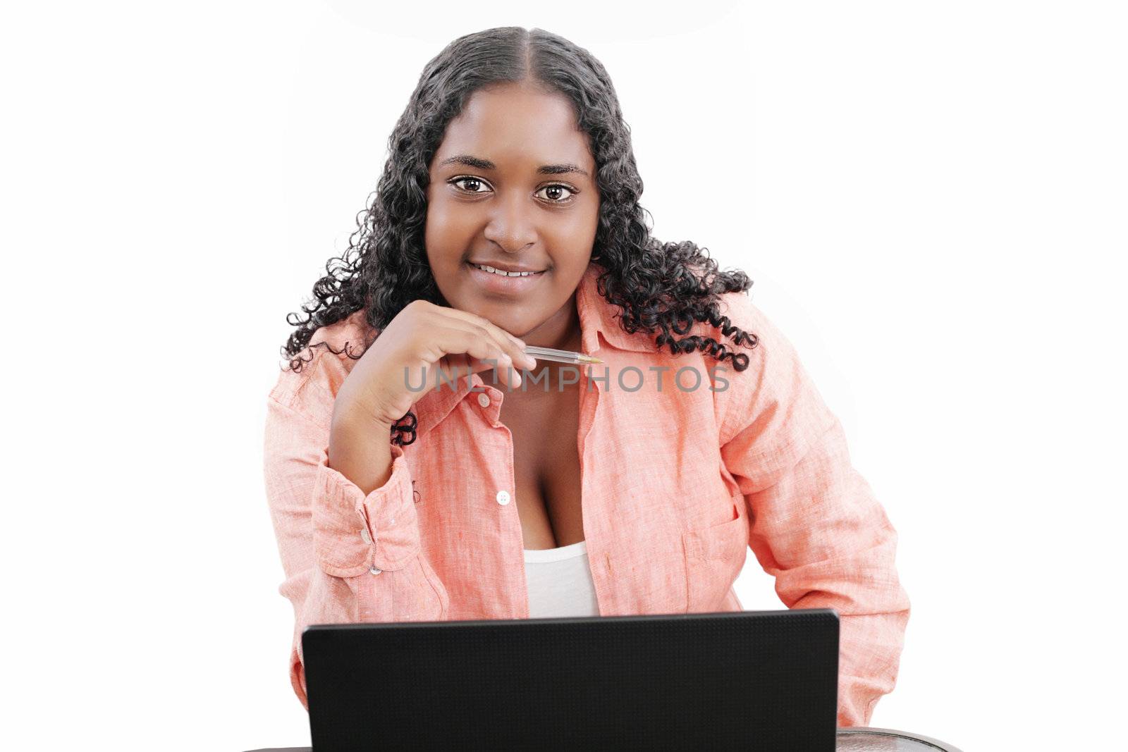 Portrait of a beautiful young black woman working on laptop