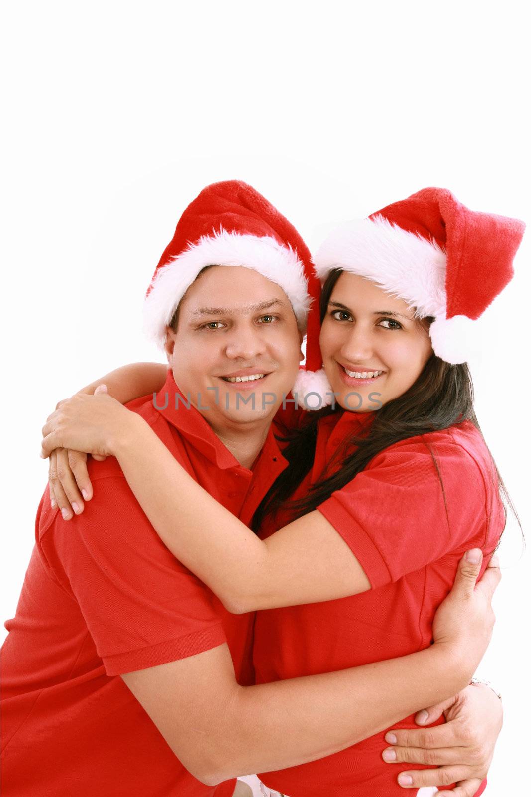 Happy christmas couple. Isolated over white background. by dacasdo