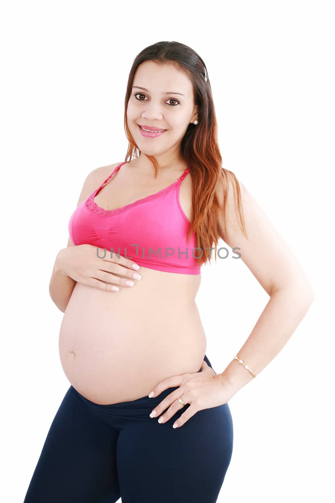 pregnant woman caressing her belly over white background by dacasdo
