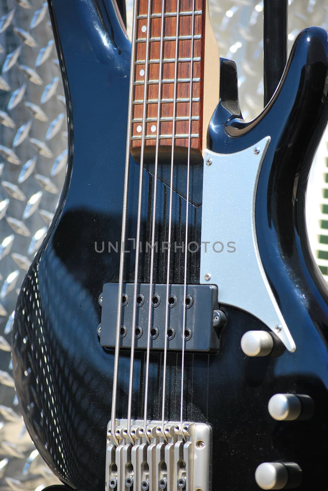 Five string electric bass guitar on the bandstand.