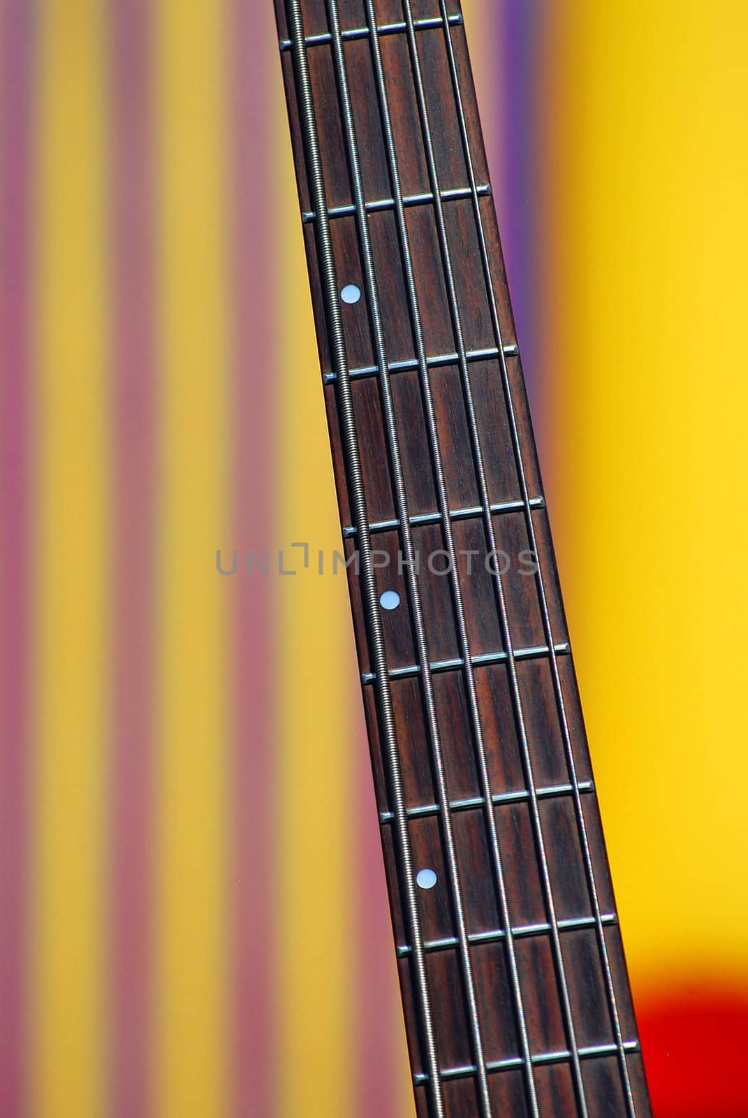 Five string electric bass guitar on the bandstand.