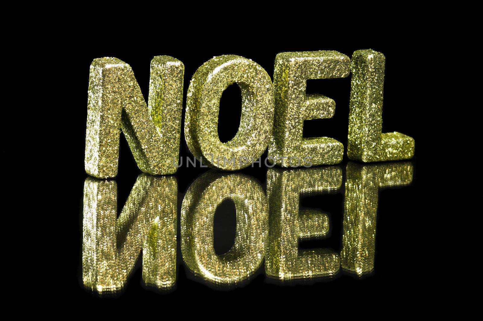 In capital letter written noel, glitter effect over black