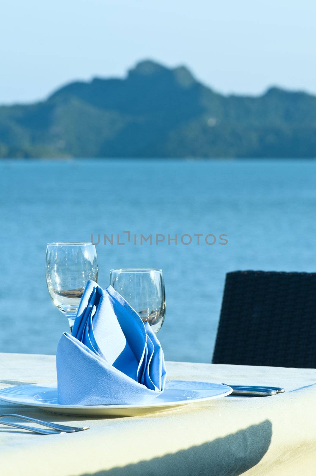 Open-air table setting for meals with elegant dishware in the afternoon