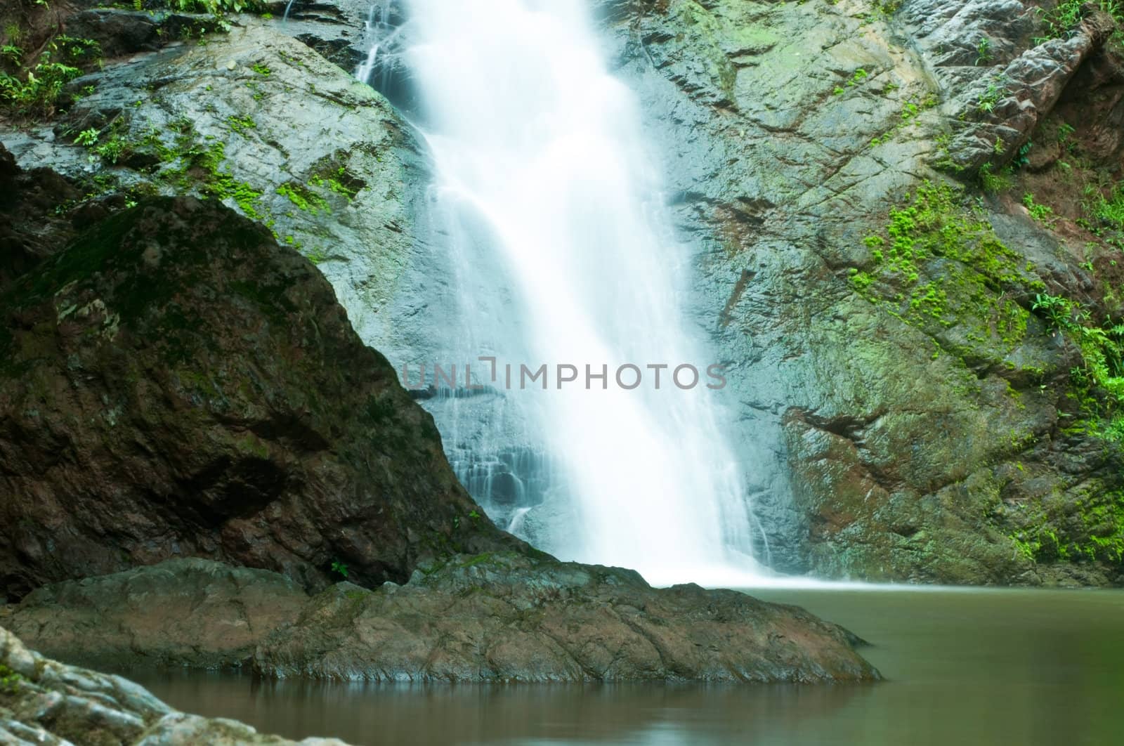 Waterfall in forest in rainy season by Yuri2012