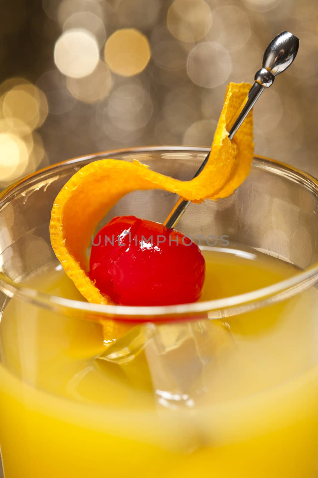 Harvey Wallbanger Cocktail in front of different colored backgrounds