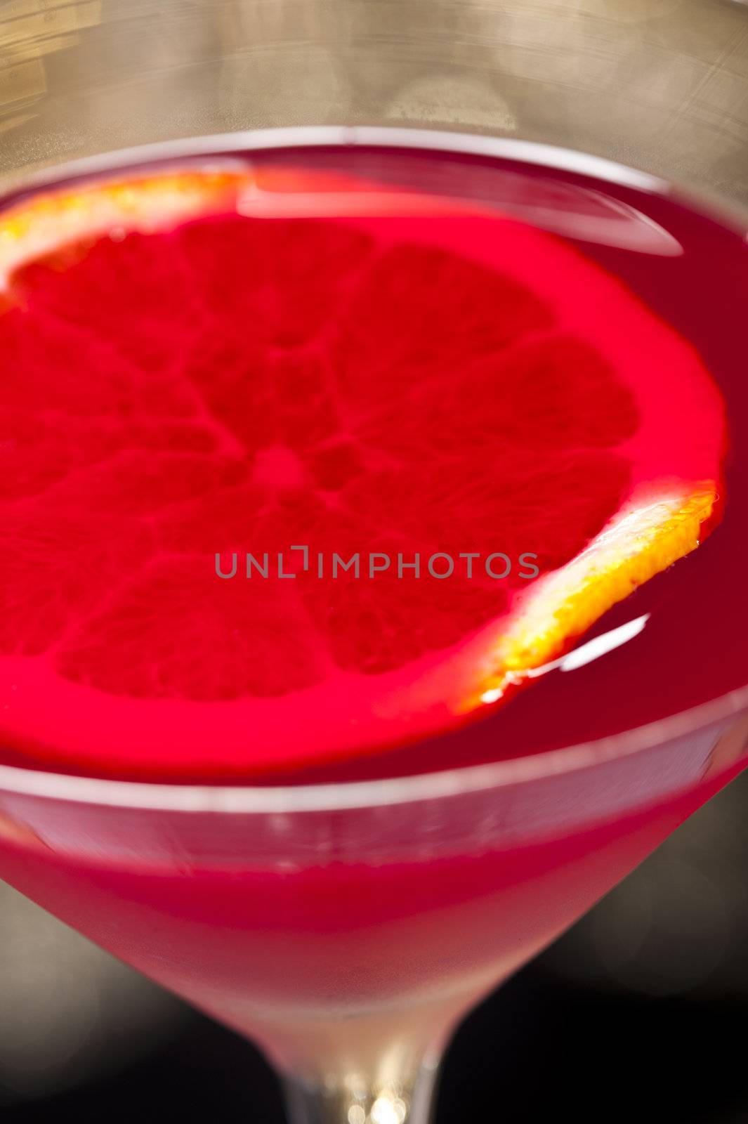 Negroni cocktail in front of different colored backgrounds