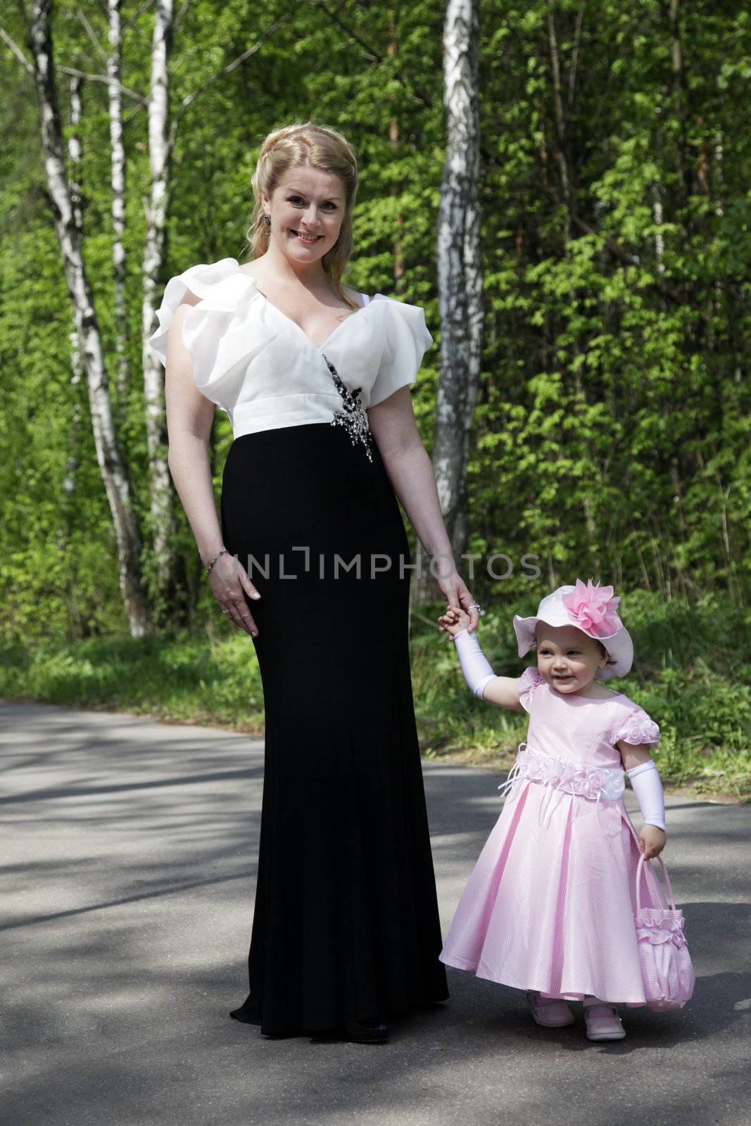 Portrait of beautiful happy smiling mother with baby outdoor, on nature