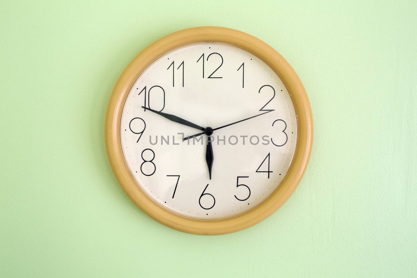Clock hanging on wall and showing current time