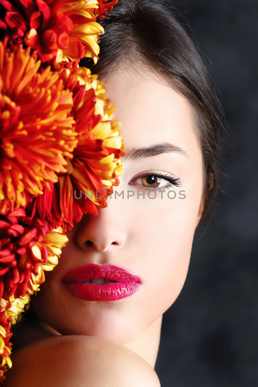 Half woman's face covered with flowers
