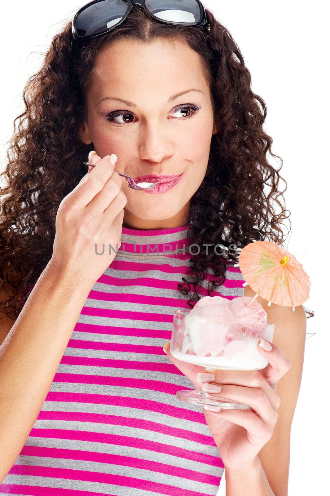 woman eating ice cream decorated with orange umbrella, wearing shirt with pink and gray horizontal stripes, isolated