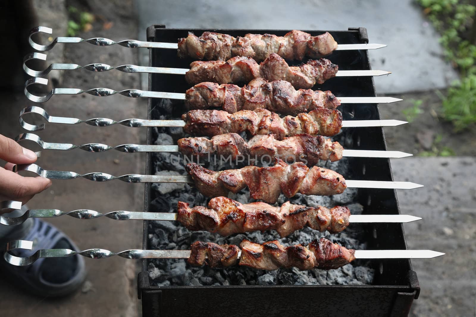 Appetizing shish kebab on metal skewers
