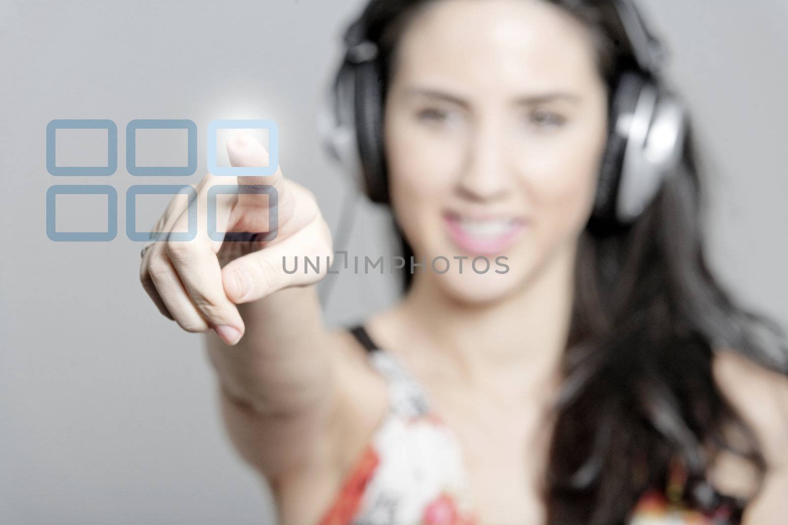 Woman selecting a song to listen to by pressing a concept button