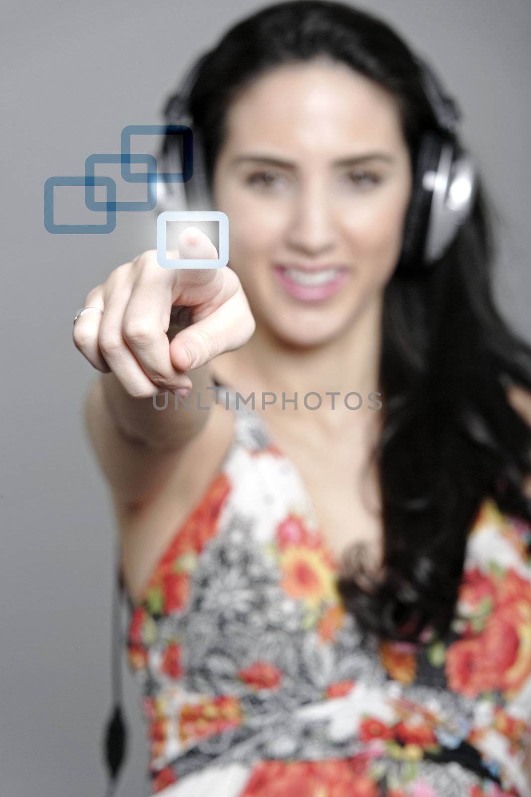 Woman selecting a song to listen to by pressing a concept button