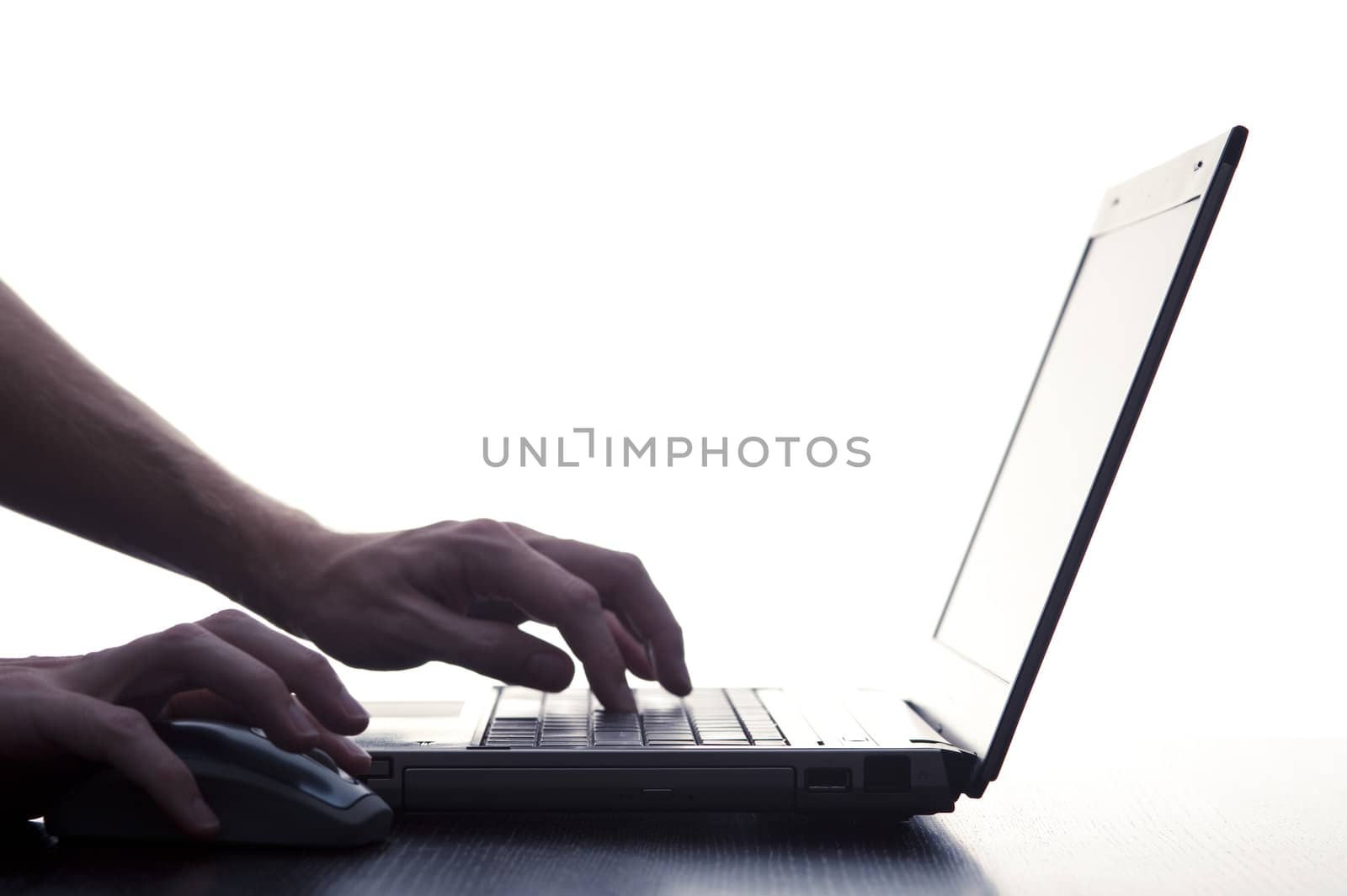 User Typing On Laptop Keyboard by stockarch