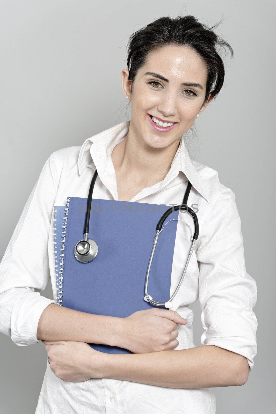 Woman doctor with stethoscope by studiofi
