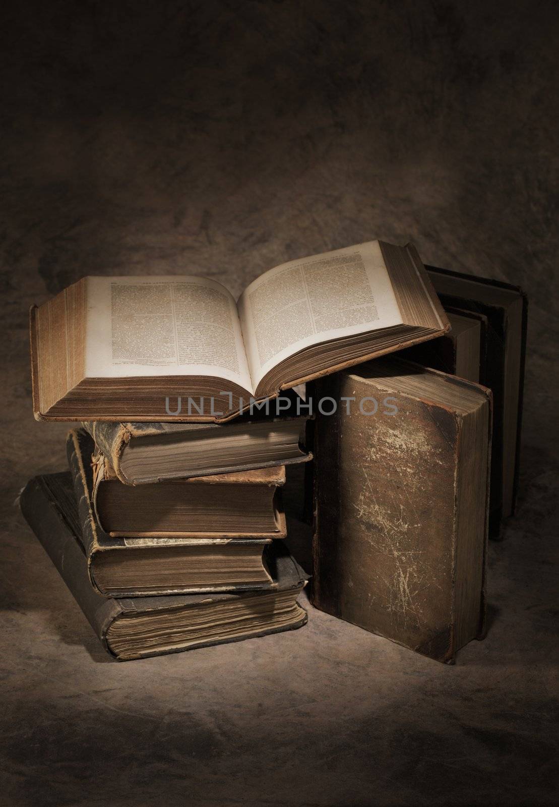 Still life of old antique books. The open book is printed in 1866.