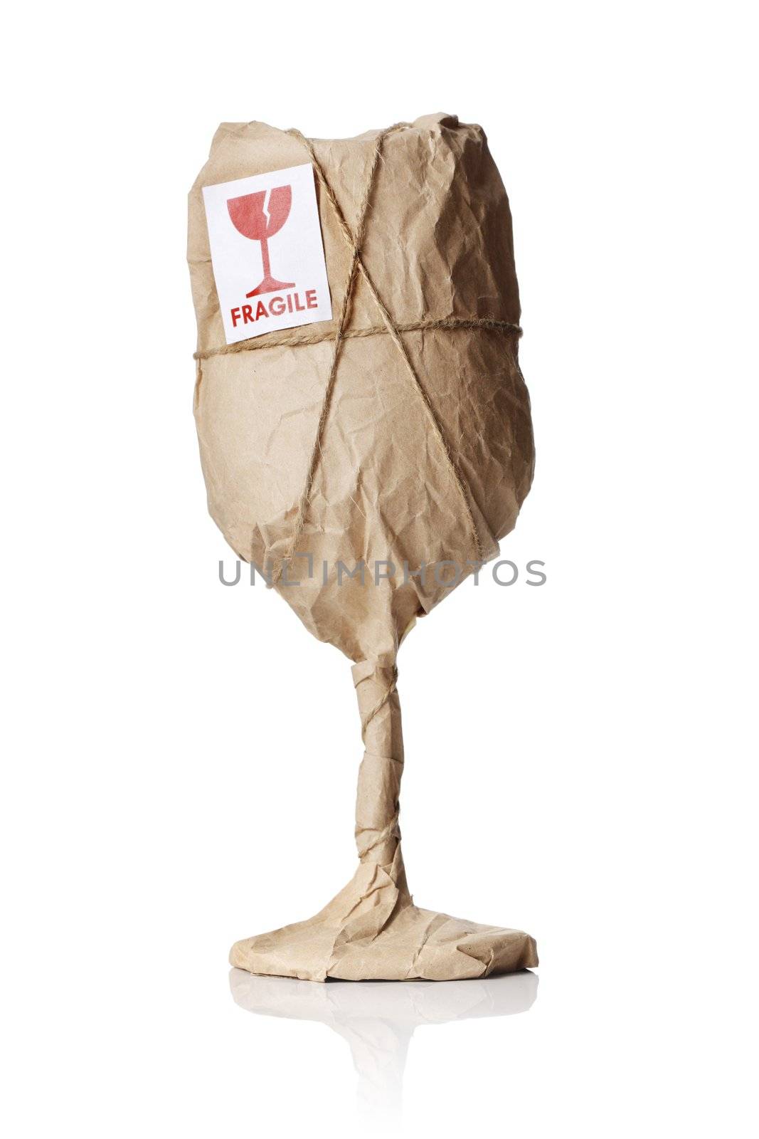 A Wine glass packaged in brown wrapping paper with "Fragile" warning sticker.