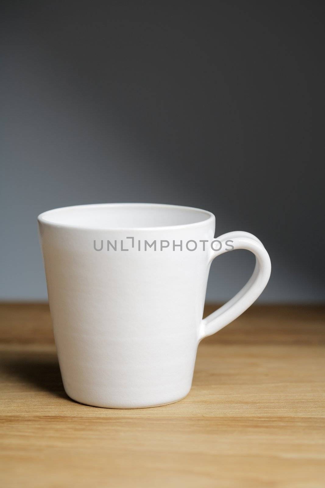 A Hand-made ceramic porcelain coffee mug.