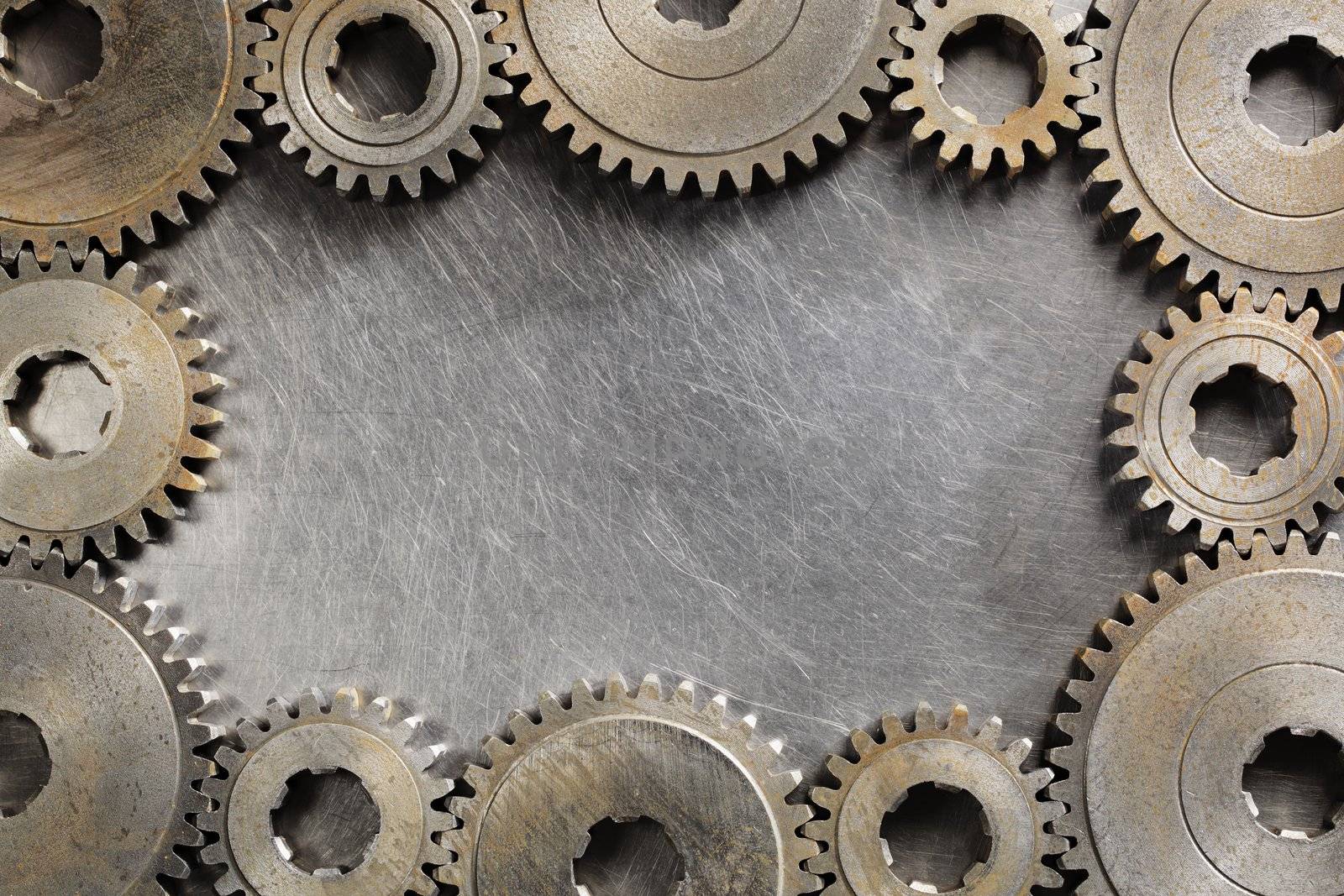 Background image made of steel and old cog wheels.