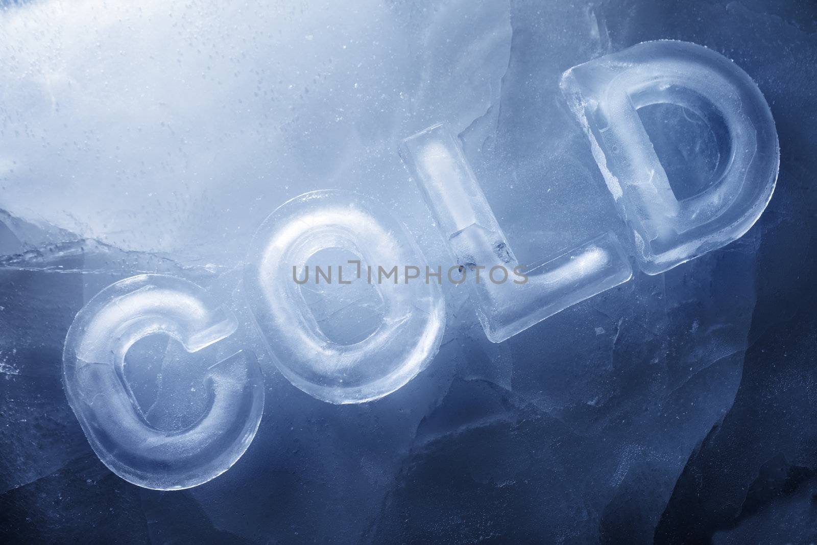 Word "COLD" made with real ice letters on ice.