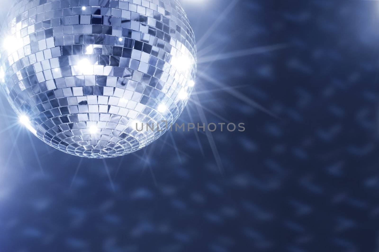 A Mirror disco ball hanging from the ceiling.