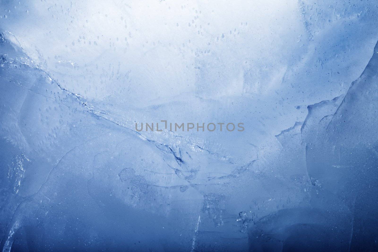 Blue toned background image made of ice.