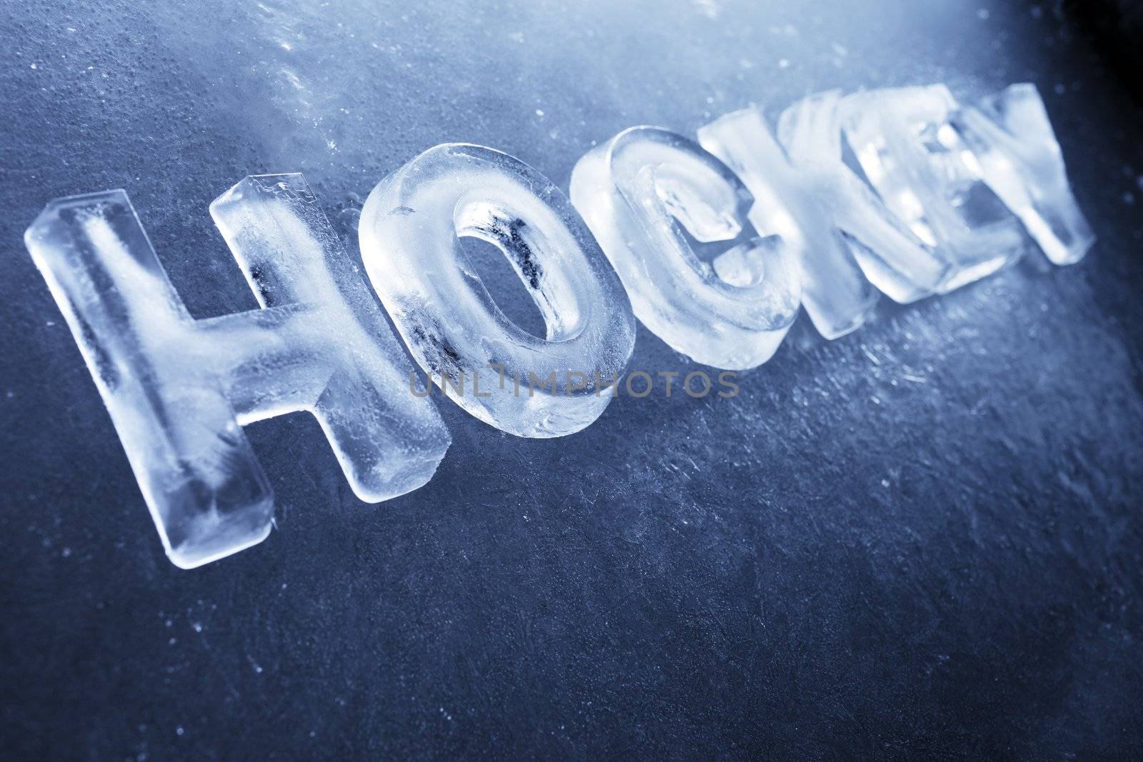 Word "Hockey" made of real ice letters on ice background.