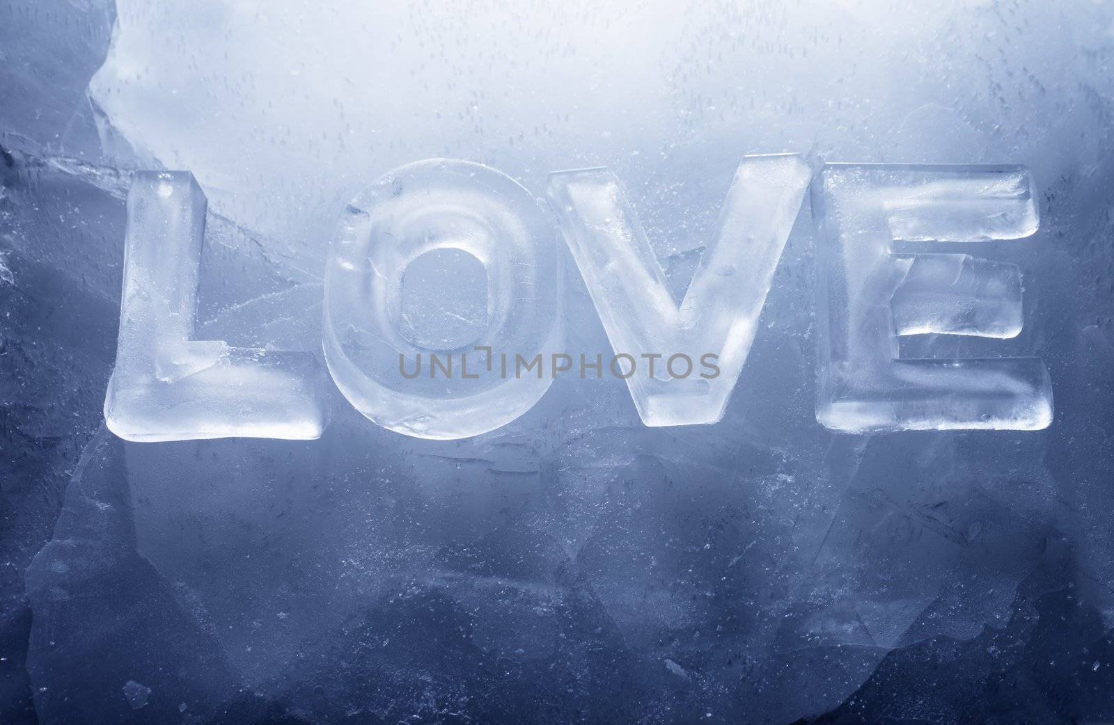 Word "LOVE" made with real ice letters on ice.