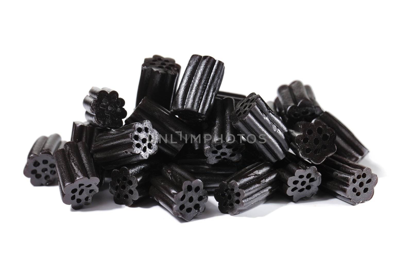 Fresh black liquorice on white background.